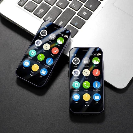SOYES XS15 Pro Smartphone for Everyday Communication and Browsing compact dual phones on desk by laptop for calls messaging and light web browsing