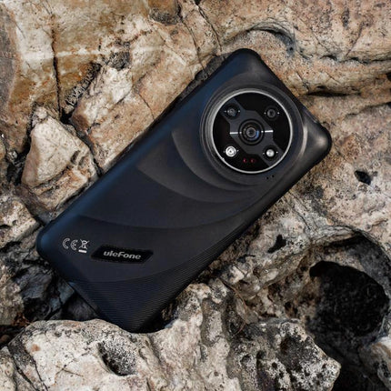 Dependable Ulefone Rugged Phone for Everyday Outdoor Tasks shown on rocky terrain highlighting rugged build and rear camera