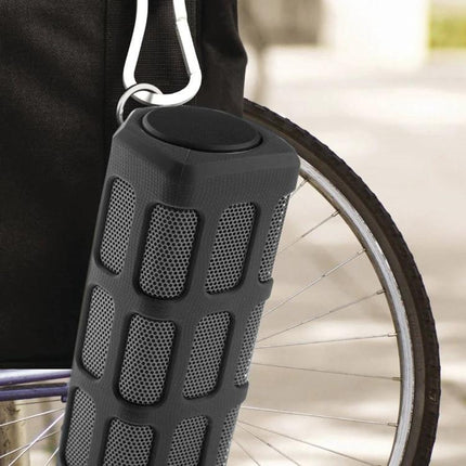 Outdoor Bluetooth Speaker With Built In Power Bank For Travel hanging on backpack with 10W waterproof speaker