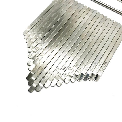 Kalimba Accessories Kit for Daily Home Music Practice showing metal note-marked kalimba tines with phonetic symbols for 21-tone learning