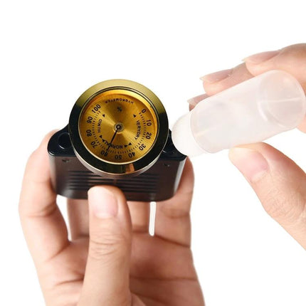 JOYO Humidifier Keeps Your Guitar Ready for Daily Practice - hands filling a compact guitar humidifier with gauge visible