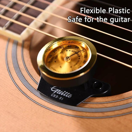 JOYO Humidifier Keeps Your Guitar Ready for Daily Practice — close-up of hygrometer humidifier placed inside acoustic guitar soundhole
