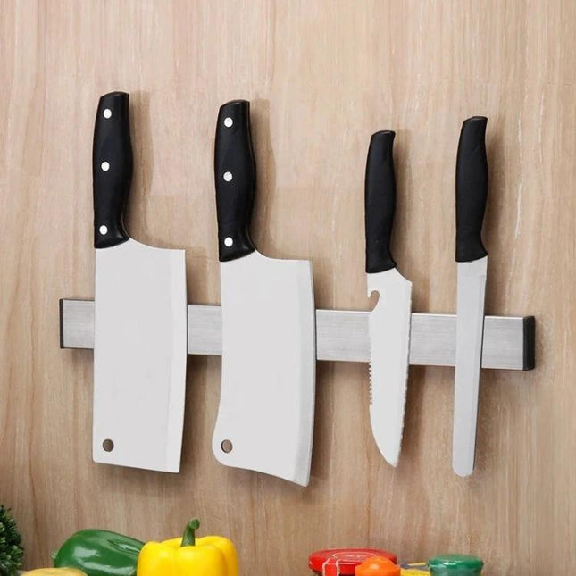 Magnetic Knife Holder Wall Mount For Kitchen Organization And Easy Access stainless steel bar holding cleavers and knives on wooden wall