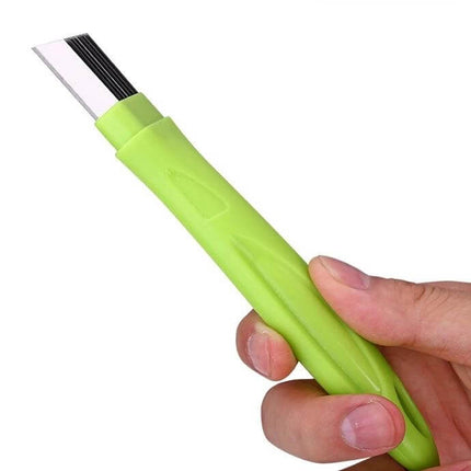 Manual Green Onion Slicer With Stainless Steel Blade For Quick Prep - green polypropylene handle with 420 stainless steel blade and protective cover shown in hand