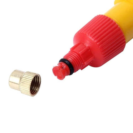 Manual Pressure Bottle Sprayer For Garden Watering - close-up of red nozzle and brass cap clipping onto standard bottle