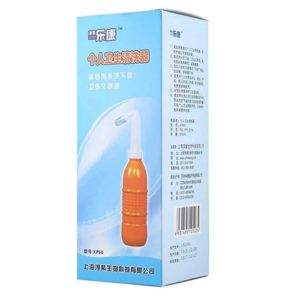 MDT-002 500ml Portable Handheld Travel Bidet for Women - compact orange travel bidet with 60° angled nozzle and 500ml bottle in retail box