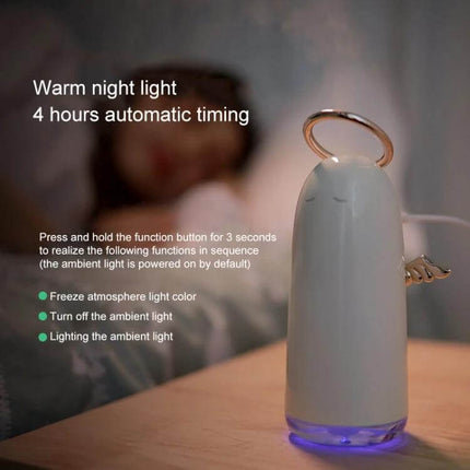 Mini Angel Atomizing Humidifier With Colorful Night Lights on bedside table emitting mist and warm ambient light