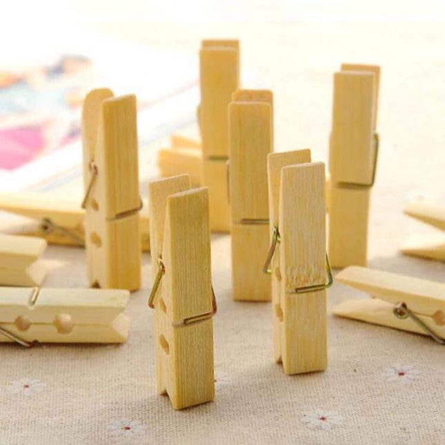 Mini Bamboo Clothes Pegs Pack For Laundry And Home Use - close-up of natural mini bamboo clips on fabric, lightweight wooden clothespins for socks and small items