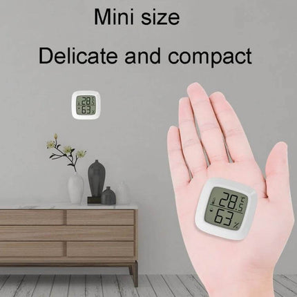 Mini Electronic Pet Temperature And Humidity Meter For Home Use compact white ABS mini sensor shown in hand and on tabletop displaying 28.5°C 63%