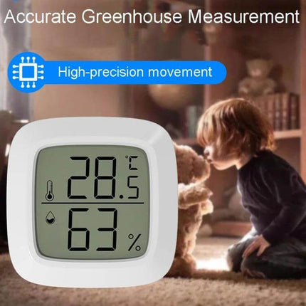 Mini Electronic Pet Temperature And Humidity Meter For Home Use compact ABS monitor showing 28.5°C and 63% humidity in a nursery setting