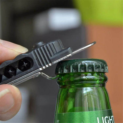 Mini Portable Multitool With LED Light For Everyday Quick Fixes opening a bottle cap with built-in bottle opener and screwdrivers visible
