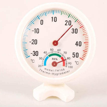 Mini Round Analog Hygrometer For Indoor Outdoor Use white 7.5cm dial showing temperature and humidity readings on plastic stand
