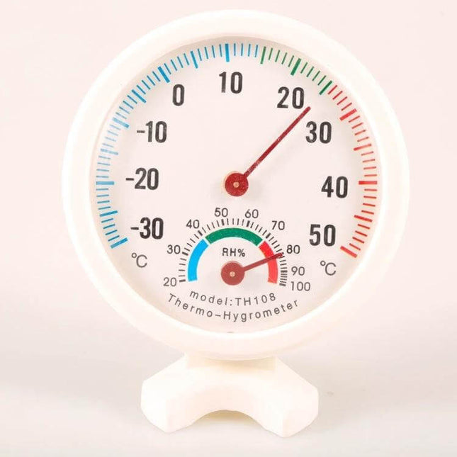 Mini Round Analog Hygrometer For Indoor Outdoor Use white 7.5cm dial showing temperature and humidity readings on plastic stand