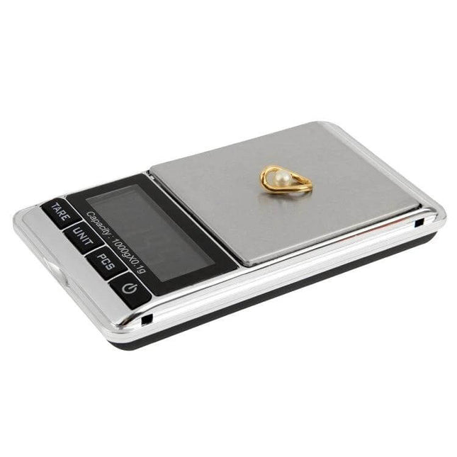 Mini Style Weigh Max Digital Scale for Everyday Use showing compact silver digital scale with bright LCD and a small gold ring on the weighing plate