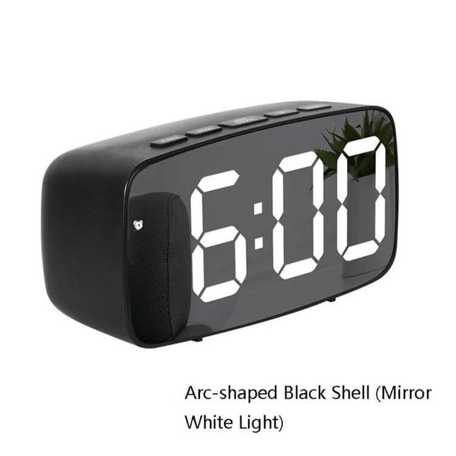Mirror Bedside Alarm Clock Arc Shaped On Nightstand - arc-shaped black mirror clock with white LED display on nightstand