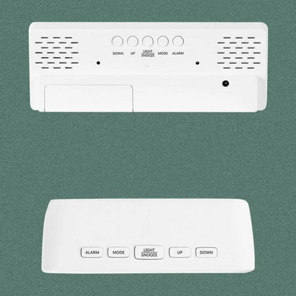 Mirror Bedside Alarm Clock Arc Shaped On Nightstand white arc-shaped mirror alarm clock on nightstand with buttons and speakers
