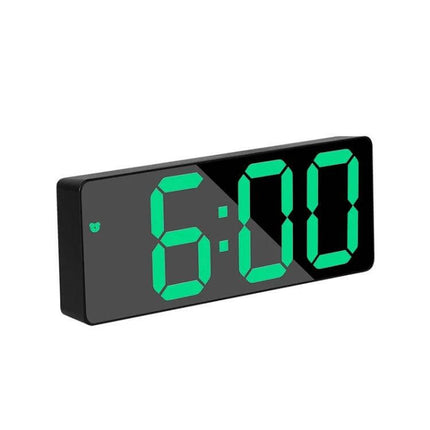 Mirror Bedside Alarm Clock Arc Shaped On Nightstand on nightstand with green LED 6:00 display and reflective coated glass mirror