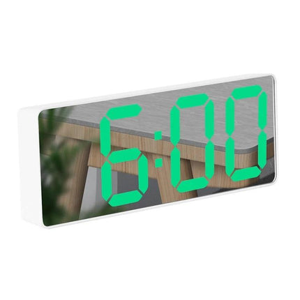 Mirror Bedside Alarm Clock Arc Shaped On Nightstand showing green LED time on reflective mirror surface on a nightstand