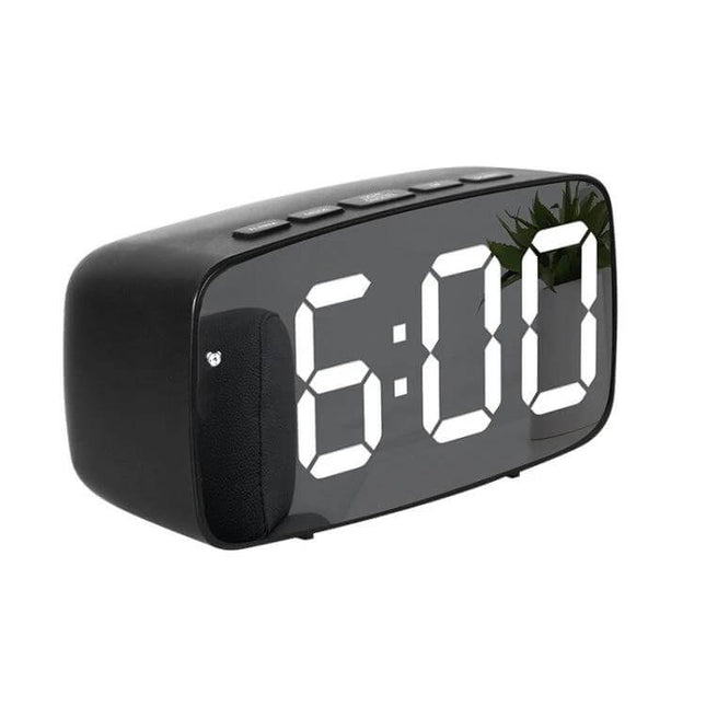Mirror Bedside Alarm Clock Arc Shaped On Nightstand - compact mirrored alarm clock with large LED display showing 6:00 on a nightstand