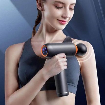 Muscles Relax Massager Gray For Full Body Relief At Home – woman using gray pulse massage gun on shoulder, portable 7.4V 2500mAh full-body relief device