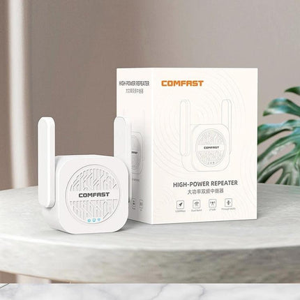 COMFAST Dual-Band WiFi Signal Extender for Home Coverage white dual-antenna repeater beside packaging on tabletop
