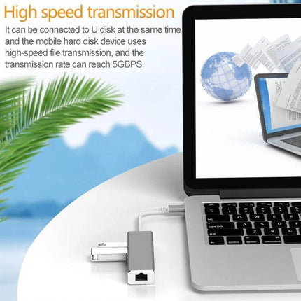 USB-C Adapter for Gigabit Ethernet and Multiple USB Ports connected to a laptop showing Ethernet and USB flash drive for stable wired internet and peripherals