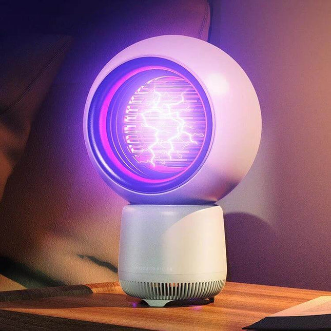 Star People Mosquito Killer Lamp USB C Rechargeable on nightstand with glowing 365nm purple light attracting mosquitoes, compact USB-C rechargeable design