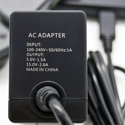 AC Adapter for Nintendo Switch Charging During Home Gaming Sessions - black AC adapter plug with cable for home console charging, visible voltage specs
