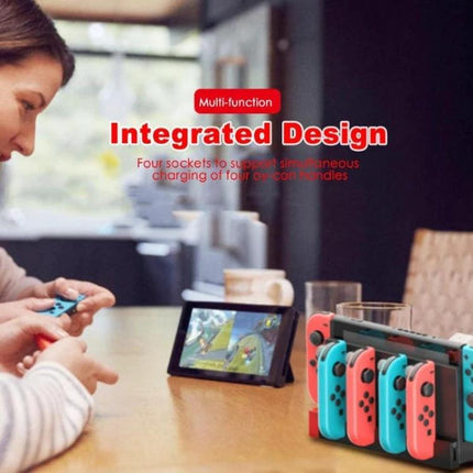 iPega Stand for Charging Nintendo Switch Joy-Con at Home showing four Joy-Con controllers charging beside a Switch in a living room