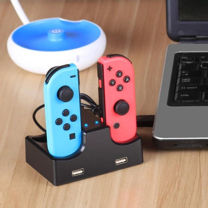 Home Charging Stand for Nintendo Switch Controllers by iplay showing two Joy‑Con controllers charging on a compact black dock