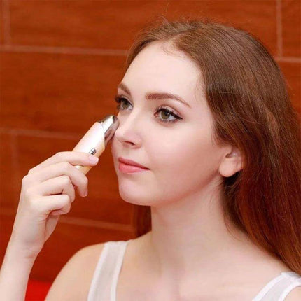 Nanum Facial Hydrating Massager Mini Humidifier For Daily Hydration being used on cheek and nose for portable mist hydration and gentle facial massage