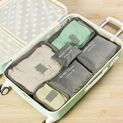 NIBESSER Travel Mesh Packing Cube Set For Clothes, 6 Piece neatly packed in suitcase showing breathable mesh and secret pouches