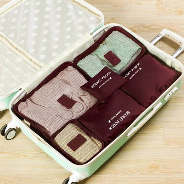 NIBESSER Travel Mesh Packing Cube Set For Clothes, 6 Piece neatly packed in suitcase with breathable mesh panels visible