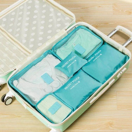 NIBESSER Travel Mesh Packing Cube Set For Clothes, 6 Piece neatly packed in suitcase with breathable mesh panels and turquoise cubes