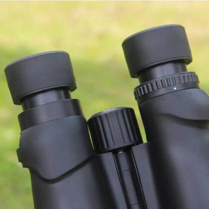 Nikula 10x42 Outdoor Binoculars For Hiking And Travel black close-up showing eyepieces, focus wheel and rubber armor for trail use
