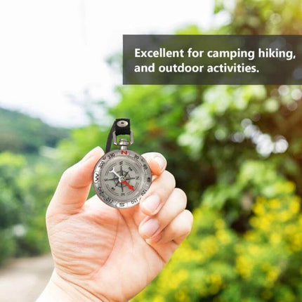 Nisa Retro Keychain Compass Aluminum Alloy Everyday Use shown held outdoors for camping and hiking