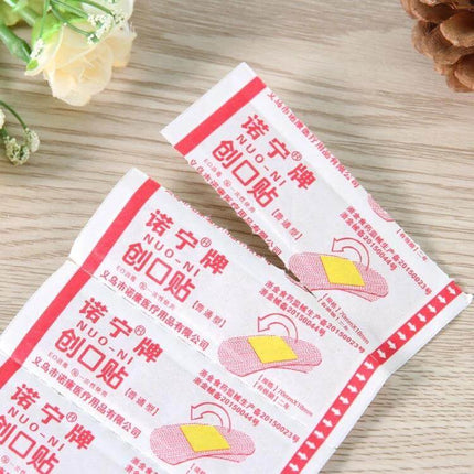Noning Waterproof Band Aid 100 Count Box For Everyday Wounds - individual waterproof bandage packet showing 8.5 x 2.9 cm pad