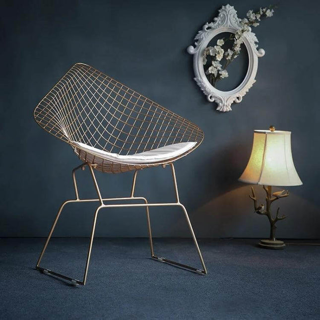 Nordic Modern Minimalist Hollow-Wire Dining Chair For Home Use - gold wire frame chair with white cushion in modern dining setting