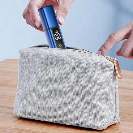 Nose Hair Trimmer With Rechargeable Battery For Daily Grooming - compact stainless steel pen-sized trimmer shown being placed into a travel pouch