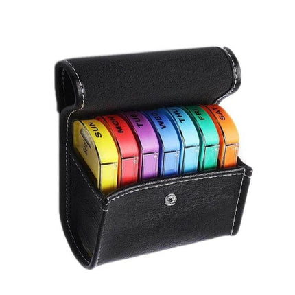 Notebook-Style 28-Compartment Portable Pill Box With Leather Bag showing seven detachable colorful daily pill boxes inside a black leather notebook case
