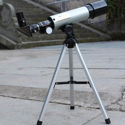 Portable 50mm Beginner Telescope With Tripod For Stargazing on lightweight tripod showing refractor tube and eyepiece for Moon and planet viewing