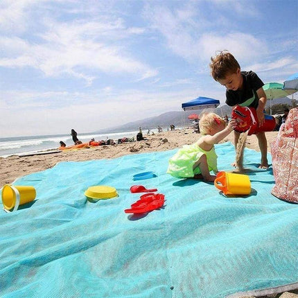 Sand Free Mat 2x2m Outdoor Picnic Beach Cushion For Outdoor Fun - family on beach using turquoise sand-free mat with kids and toys
