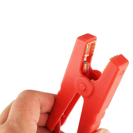12V Smart Jump Lead For Cars With Battery Protection — red insulated positive clamp held in hand, anti-short and reverse-polarity safety design