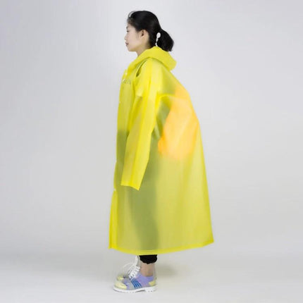 Transparent Windproof One-Piece Raincoat for Everyday Use modeled side view in yellow EVA lightweight antibacterial material