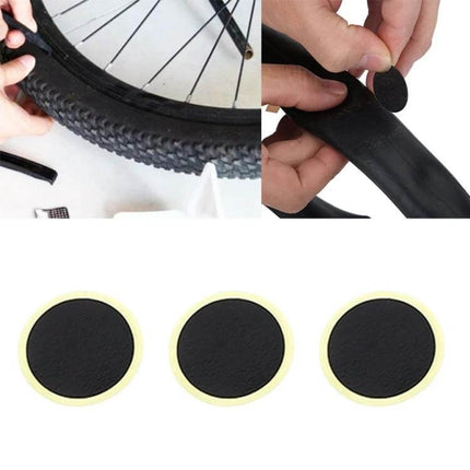 Manual Mini Portable Bicycle Pump Kit With Glue Free Patches And Tire Levers - closeup of glue-free round tire patches applied to inner tube for quick repair