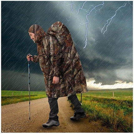 Camouflage Outdoor Backpack Raincoat for Versatile Protection - hiker wearing camo poncho backpack cover in heavy rain and lightning