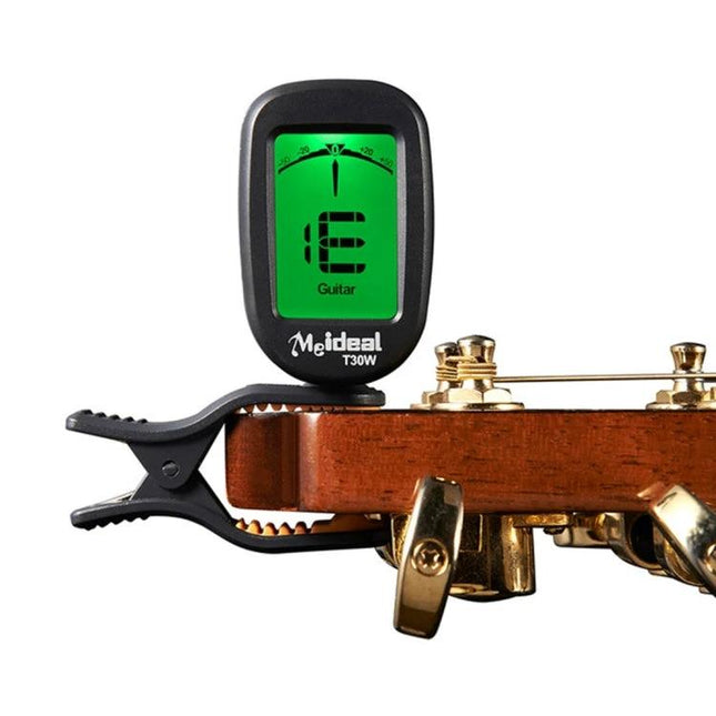 Handy Clip-On Tuner for Daily Music Practice and Travel clipped to a guitar headstock with green LCD display