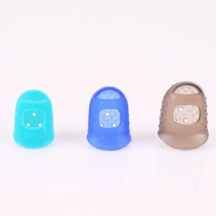Finger Protectors for Daily Guitar and Ukulele Practice - silicone thumb and finger caps in teal blue and brown for blister-free practice