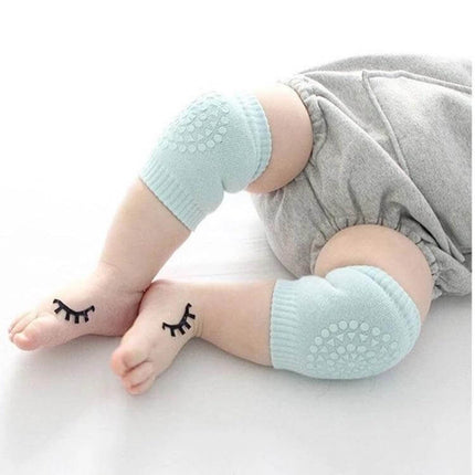 Baby Knee and Elbow Guard Pads for Crawling and Walking Grey soft padded grey knee and elbow protectors on baby legs for crawling
