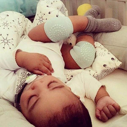 Baby Knee and Elbow Guard Pads for Crawling and Walking Grey on sleeping baby, soft padded knee and elbow protection for crawling and first steps